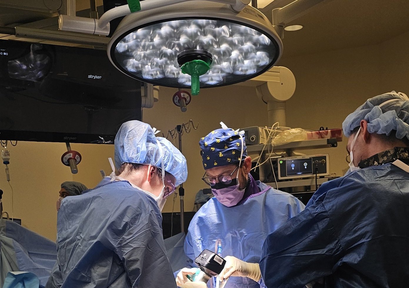 Dr. Yuval Glick operating with his team